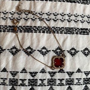 Vintage gold bracelet with red gemstone